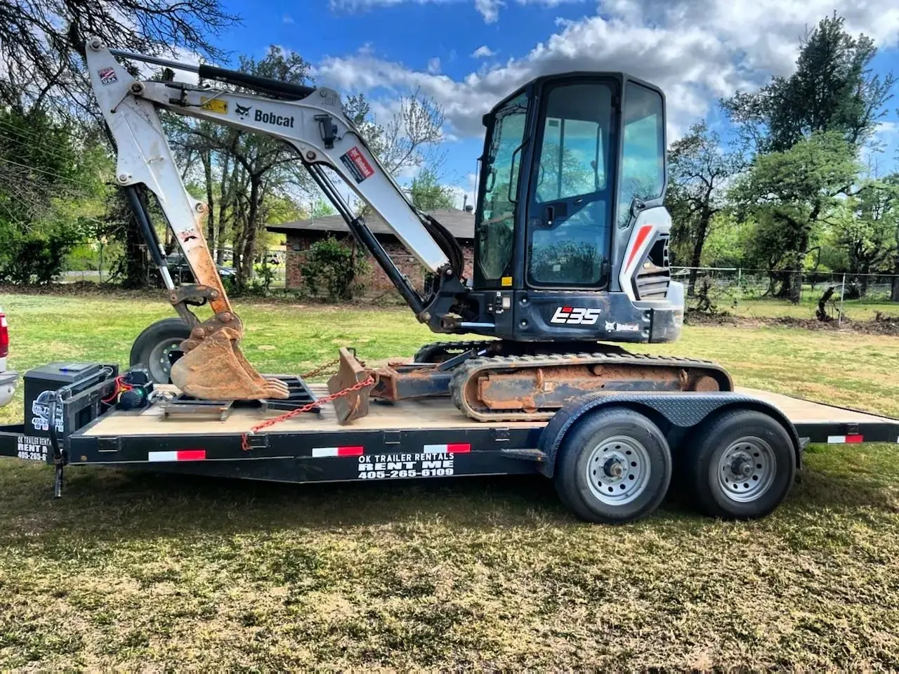 Bobcat E35 excavator on equipment trailer rental OKC
