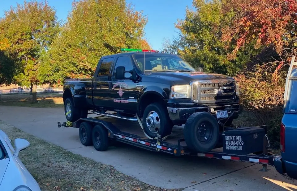 Ford F350 dually on car hauler rental Yukon OK